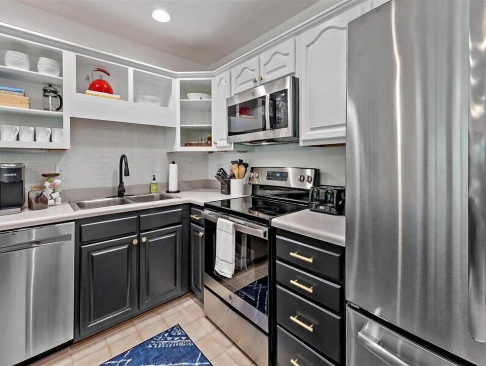Kitchen with dishwasher & 3 coffee makers (Keurig, Drip, and French press).