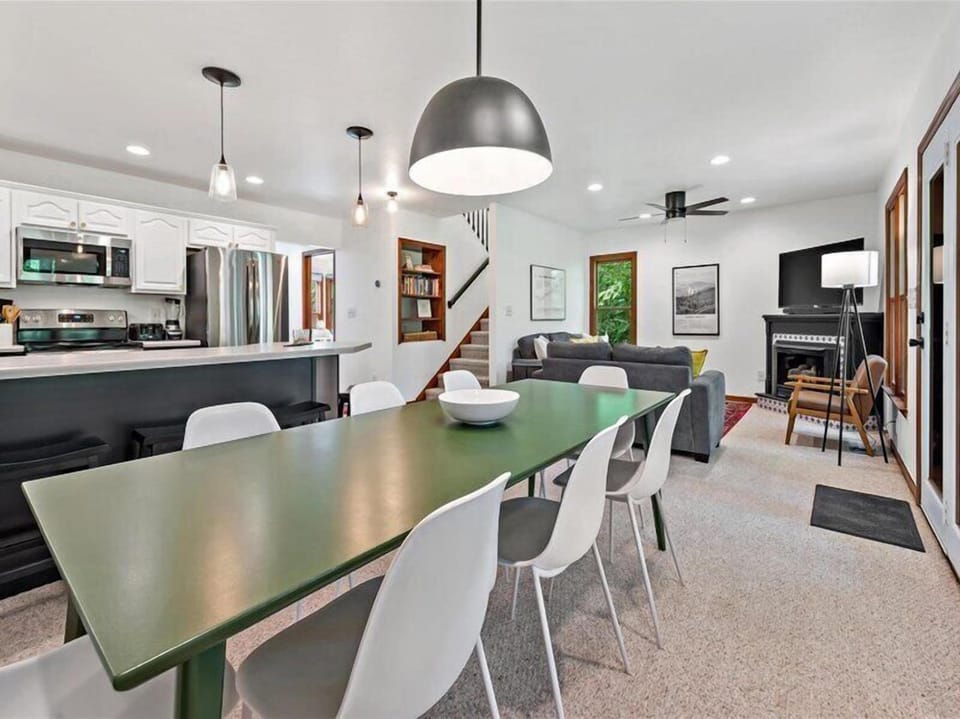 Share meals & moments around the dining table that opens to both the kitchen and living room.