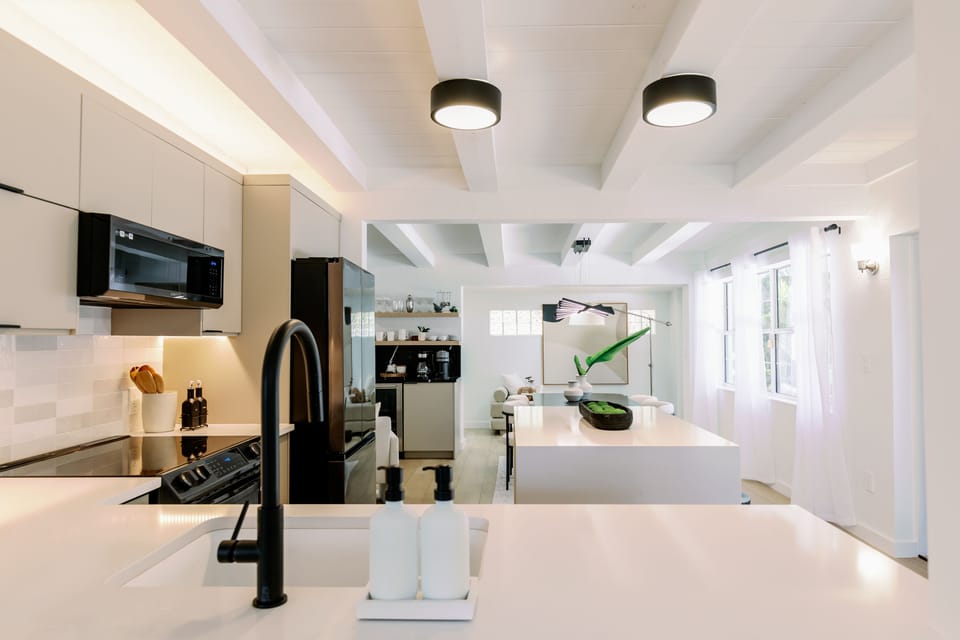 Kitchen, continuing into the Dining and Bar Lounge area