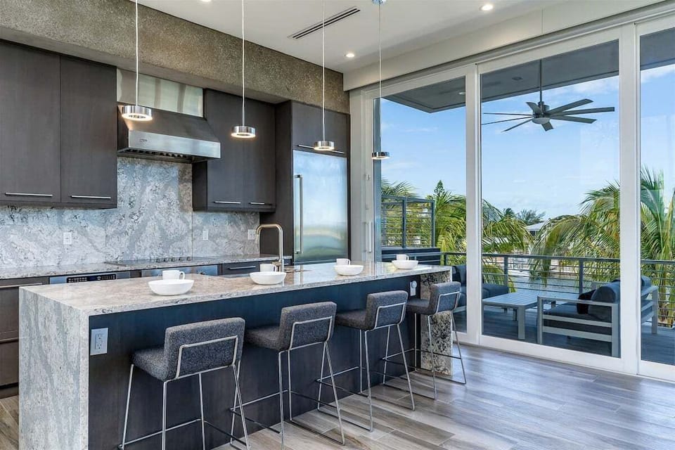 2nd level sleek and modern kitchen with top line appliances.