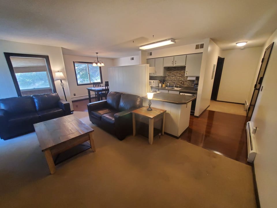 KP101APT1 - Living Room w/love seats, patio access, decorative fireplace, and Roku TV