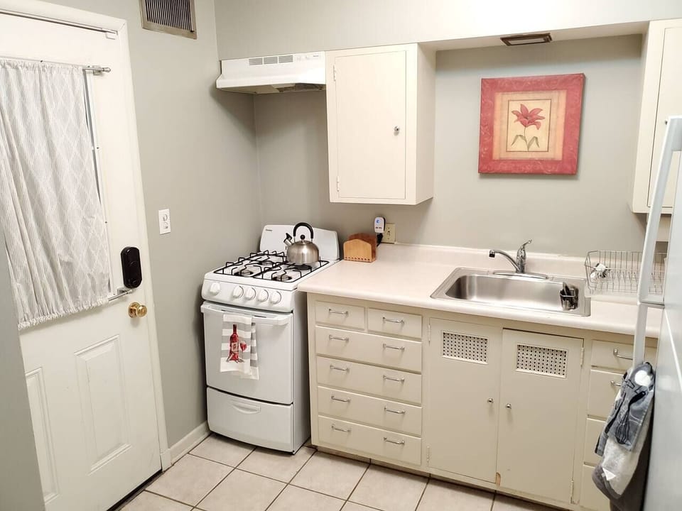 Kitchen w/essentials, microwave, stove, oven, refrigerator, freezer, coffee machine