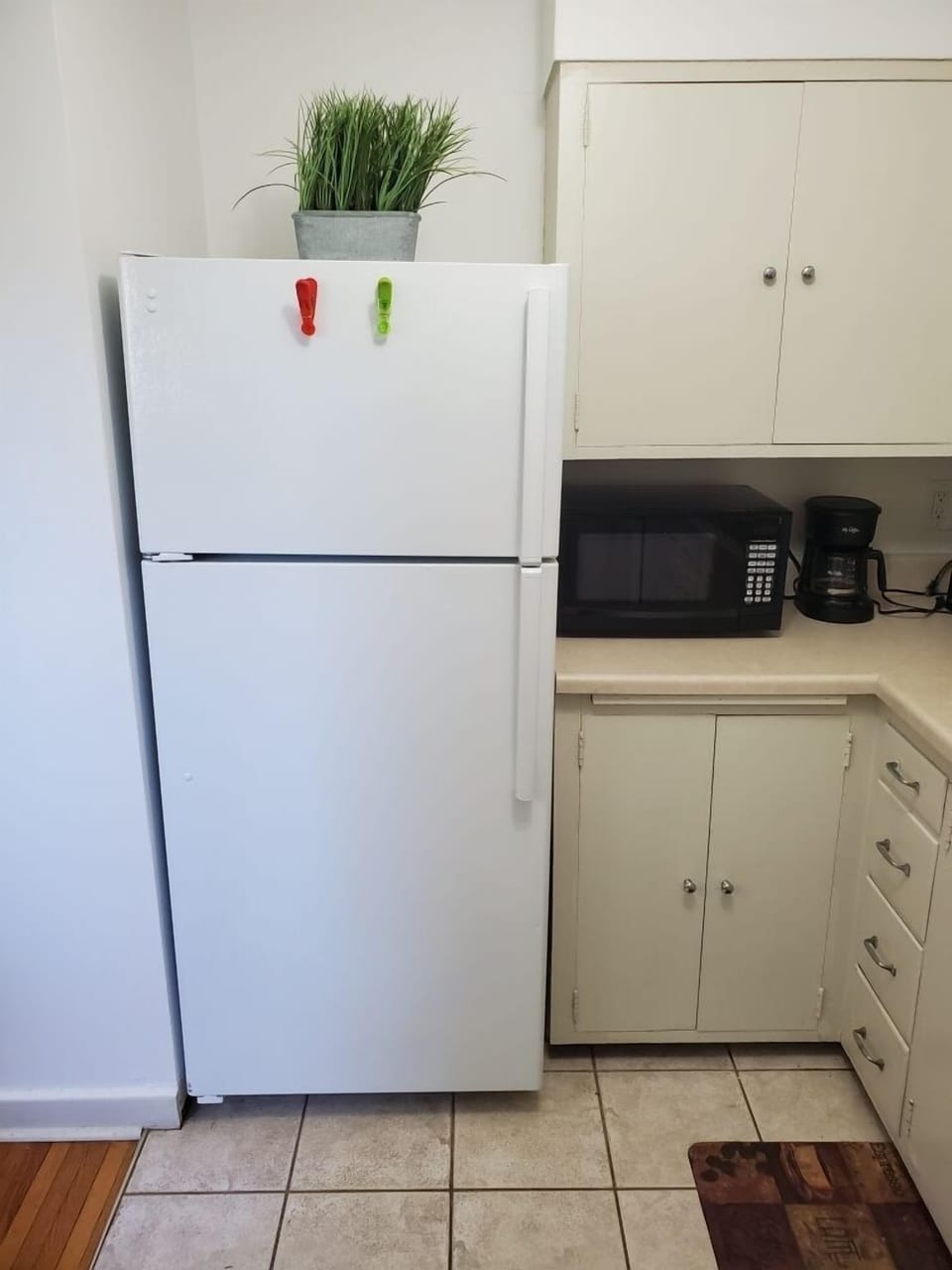 Kitchen w/essentials, microwave, stove, oven, refrigerator, freezer, coffee machine