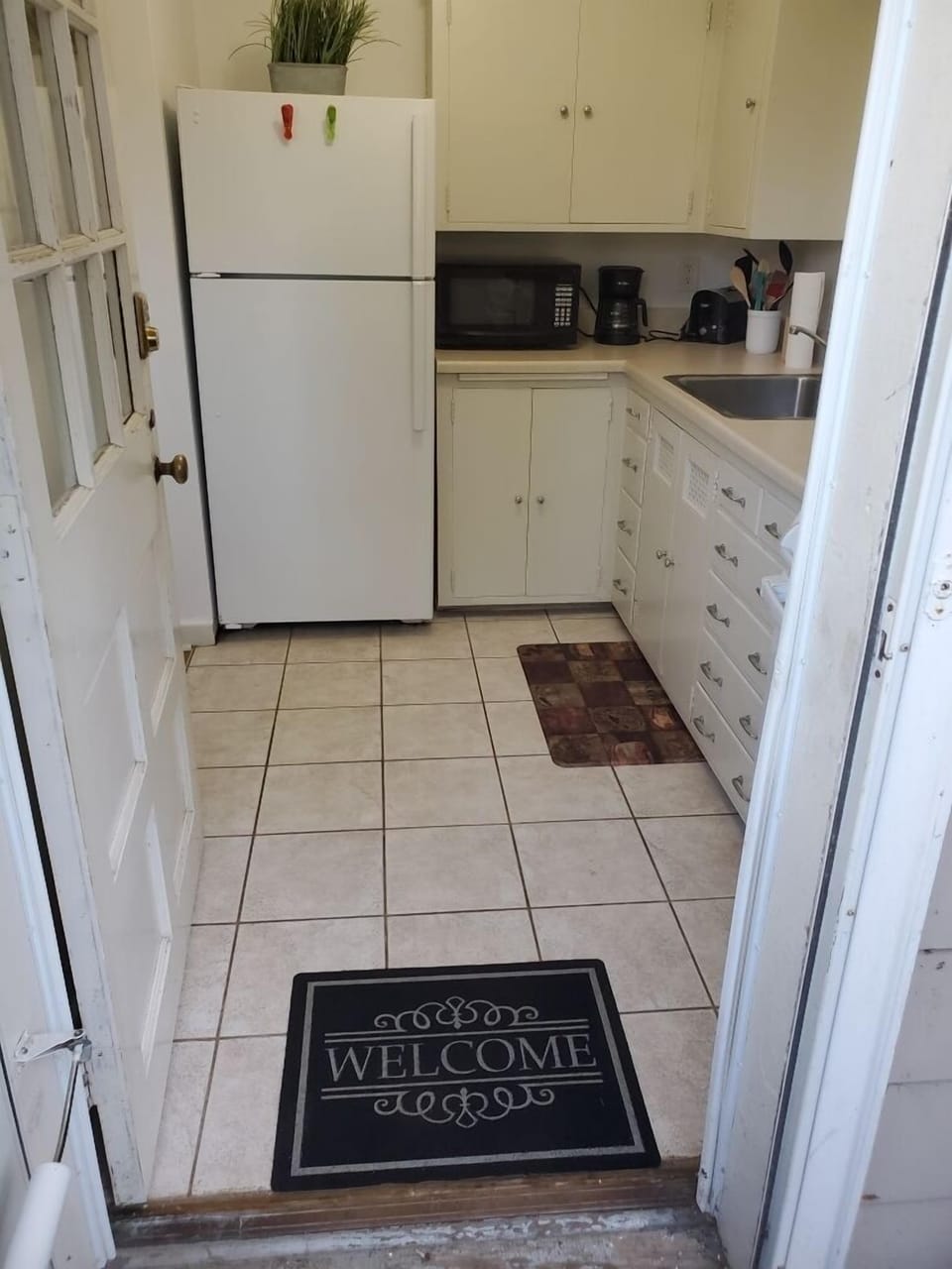 Kitchen w/essentials, microwave, stove, oven, refrigerator, freezer, coffee machine