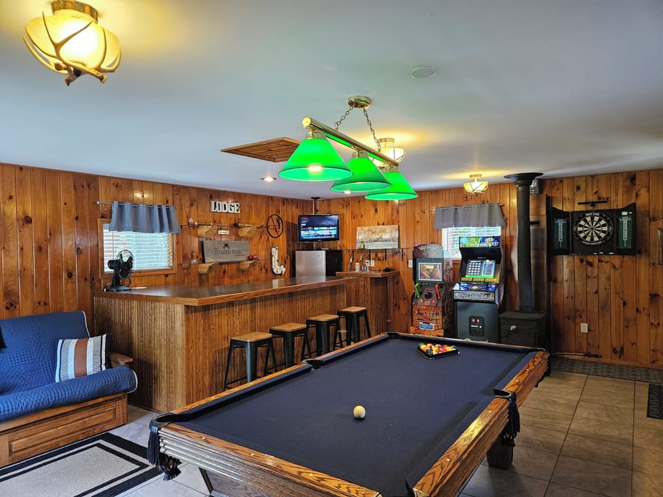 rec room with Big Buck Arcade and Golden tee with other various games 