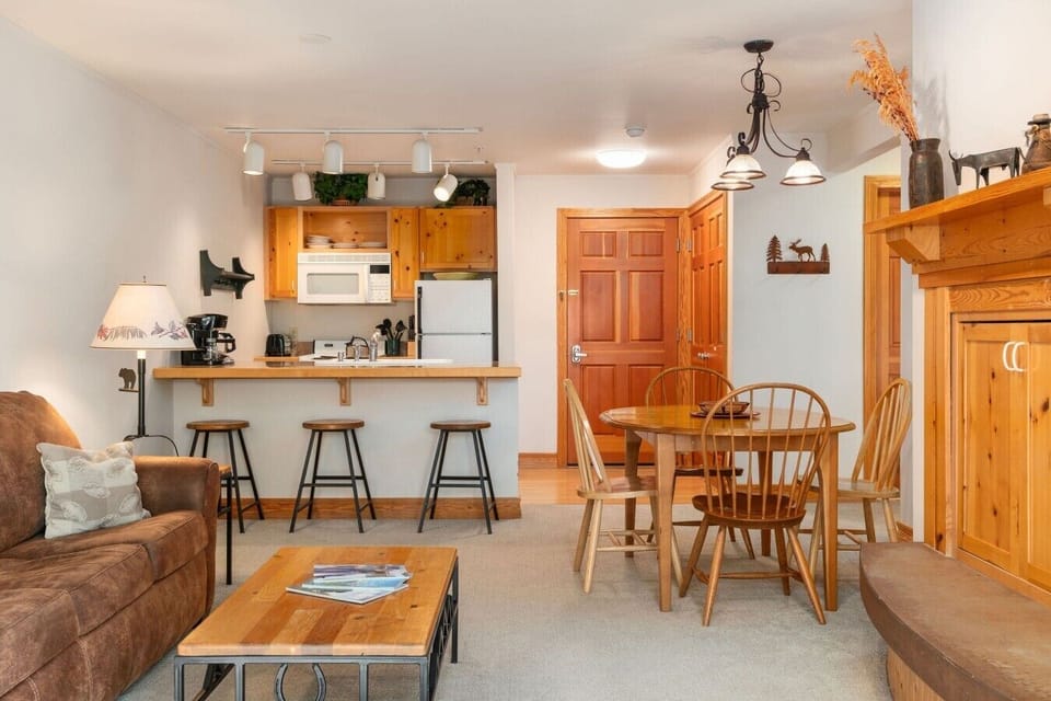 View of living room to kitchen and entryway