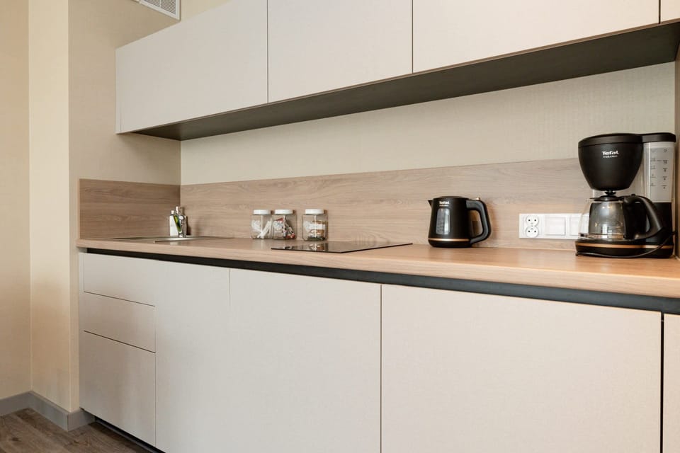 A closer look at the kitchen, showcasing the appliances, utensils, and countertop design.