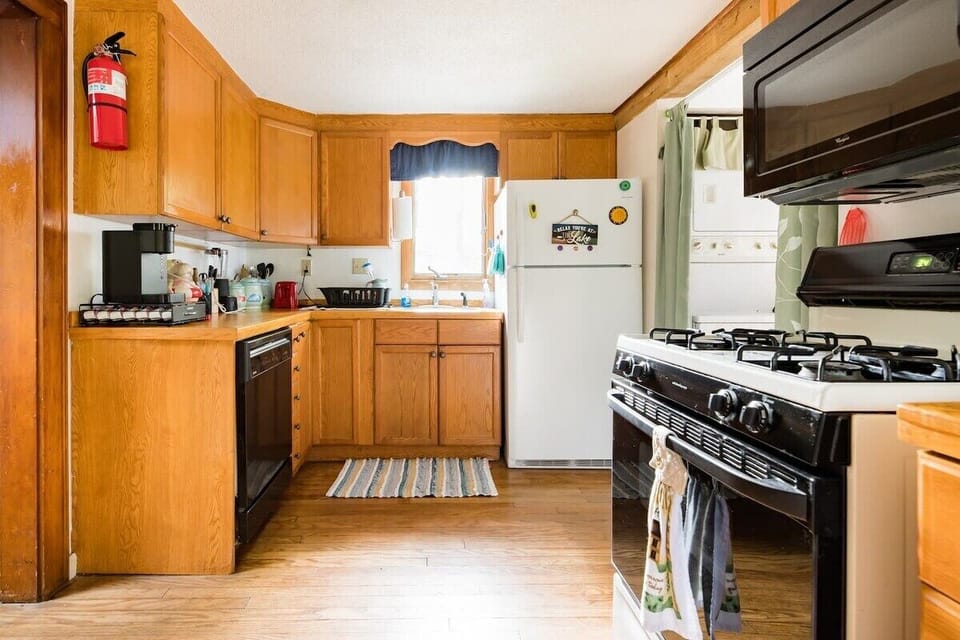 [Kitchen] To your left is the Keurig coffee machine, always stocked for the morning brew.