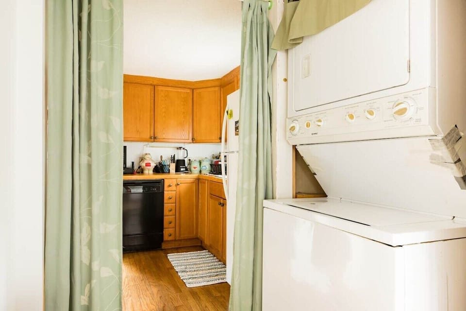[Laundry] The washer and dryer are positioned for practicality in this well-designed lake house.