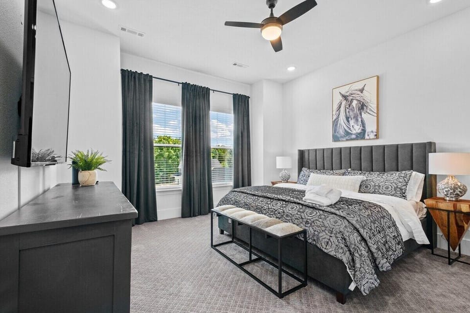 Our second King bedroom, located upstairs, is complete with plush bedding, Roku TV, plenty of storage and en suite bath.