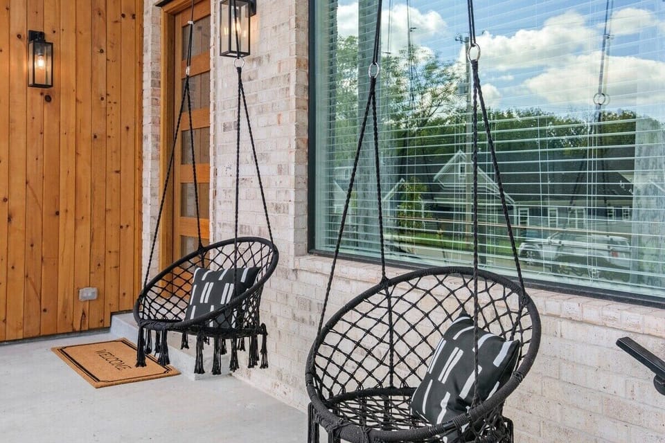 From here forth we'll begin the walking tour of our home. On the front porch, you'll find two hanging hammock chairs.