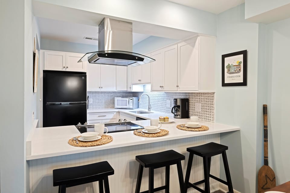 Fully renovated kitchen with 3 bar stools