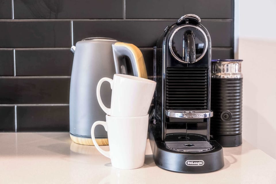 Pour yourself a cup of coffee every morning using the Nespresso machine provided.