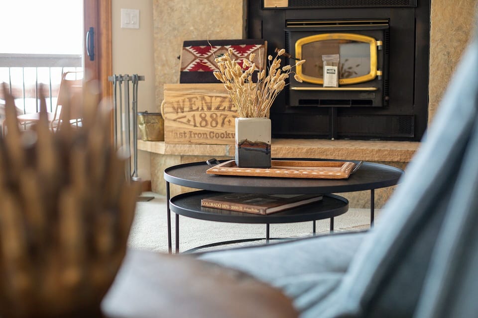 Settle in by the cozy fireplace, where rustic charm meets modern comfort—your perfect retreat for unwinding after a day of exploring.