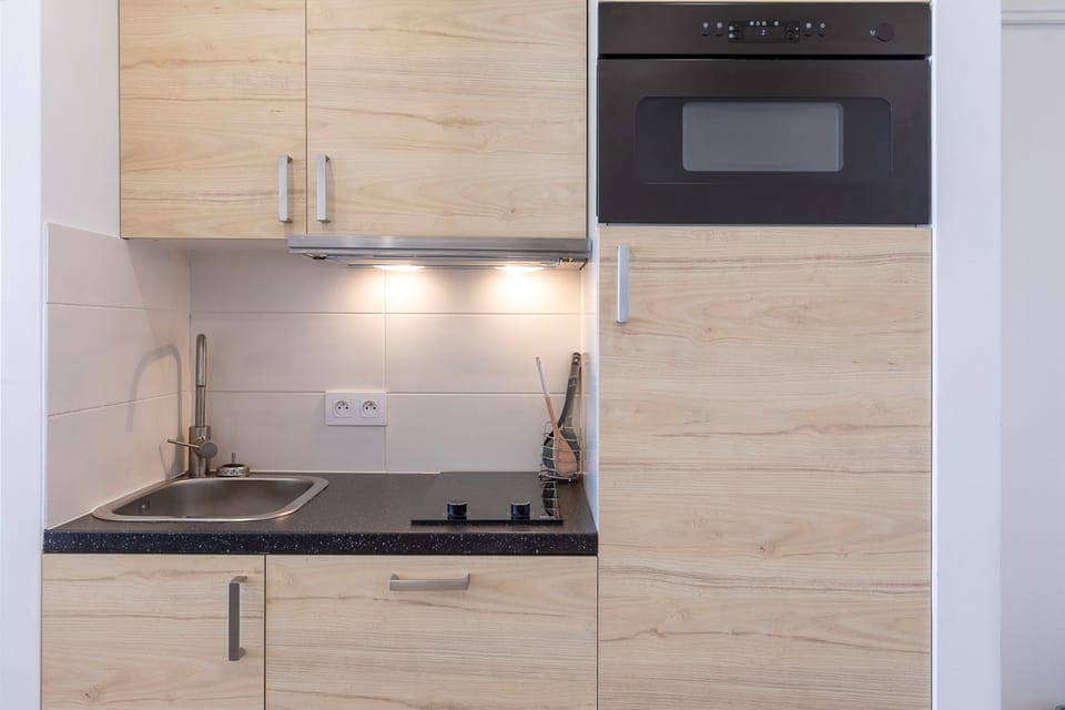 Apartment, Ensuite (Vue sur Montagne -App 617) | Private kitchen | Fridge, microwave, stovetop, dishwasher