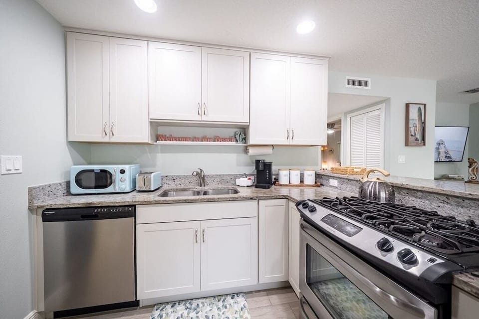 Gas stove, tea kettle, Keurig coffee maker.