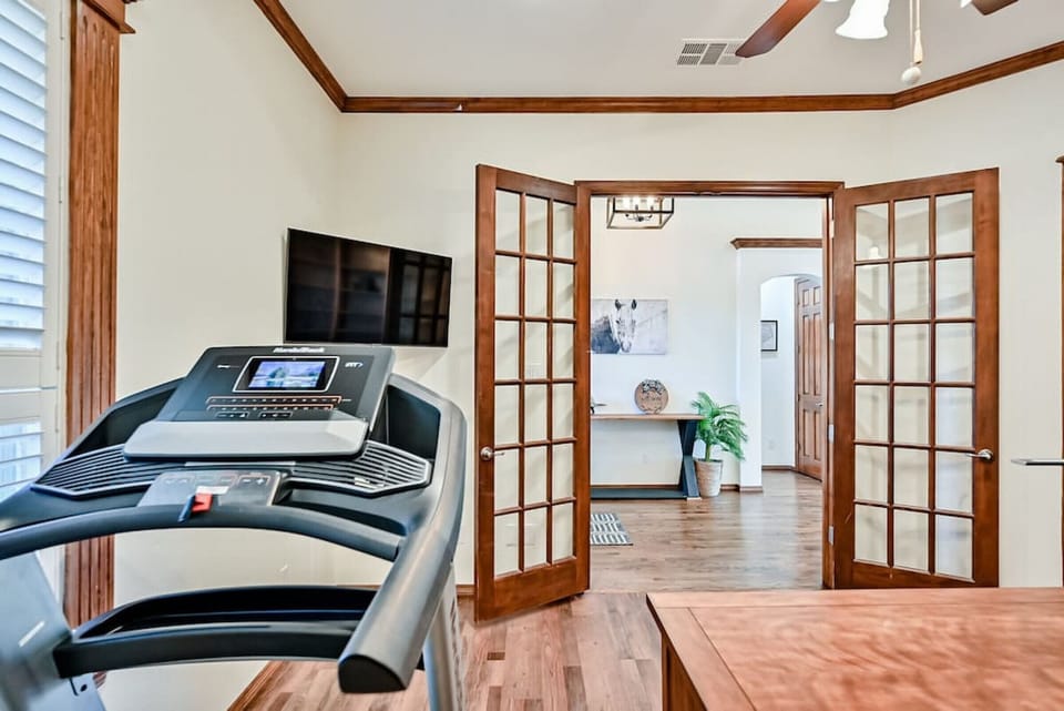 Treadmill and TV in office