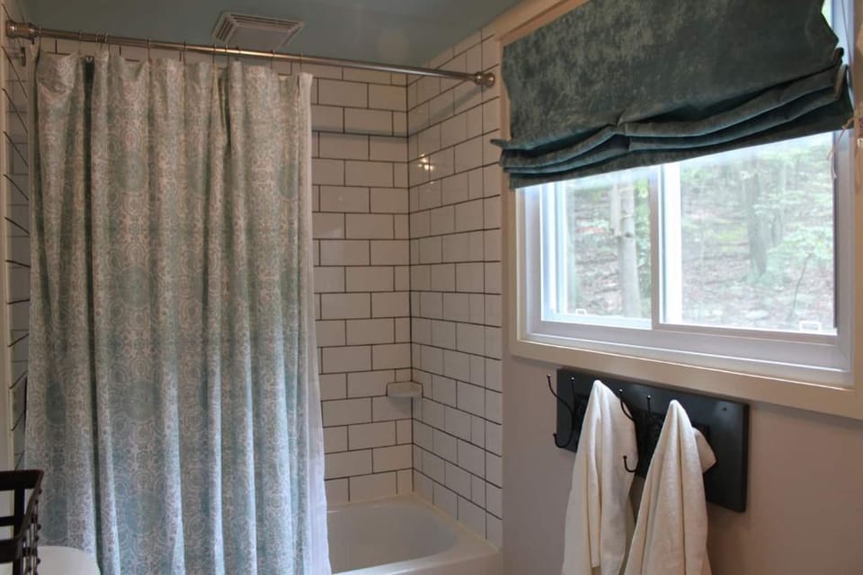 Take a soak in the clean, oversized bathroom. 