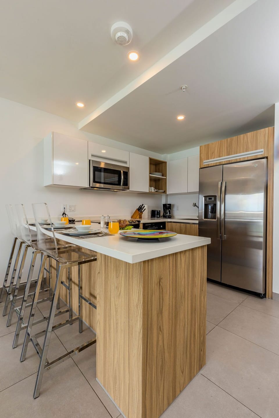 Your private bathroom features a modern walk-in shower, clean contemporary finishes, and fresh towels ready for a refreshing start to your day.