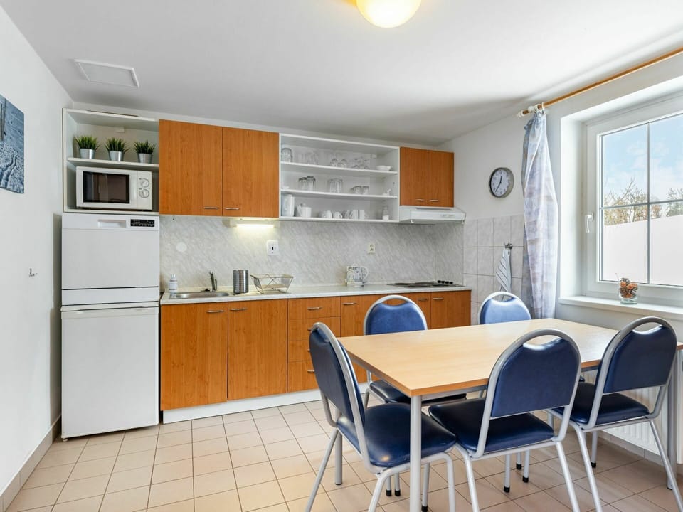 Furniture, Cabinetry, Property, Building, Countertop, Table, Chair, Wood, Lighting, Interior Design