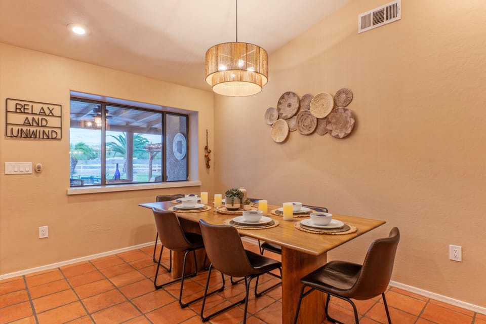 Serve casual or formal meals at the dining table with seating for 6.