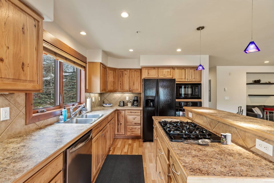 Spacious, fully stock kitchen - Great open plan so you can prepare food while being part of the conversation!