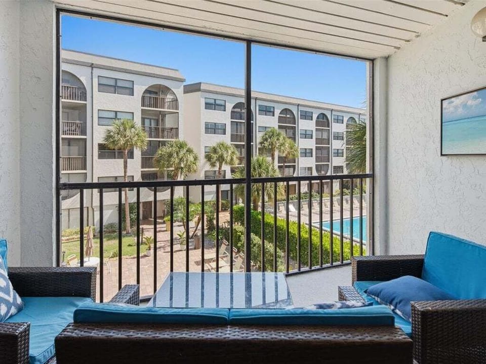 back screened porch with pool view