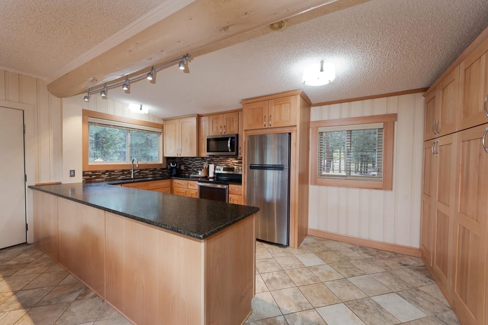 Kitchen fully stocked with cookware and bakeware.