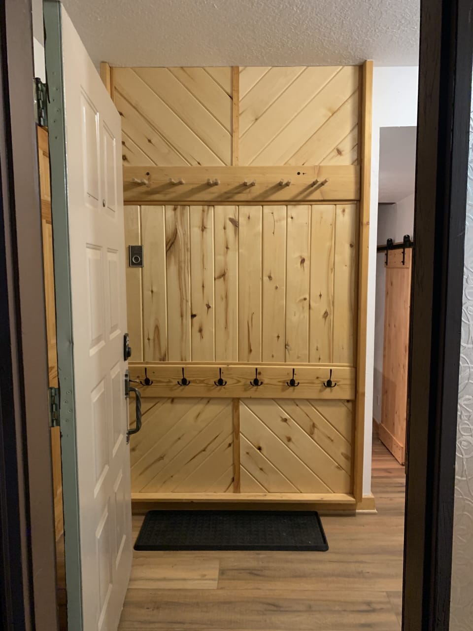 mud room storage rack at front door 