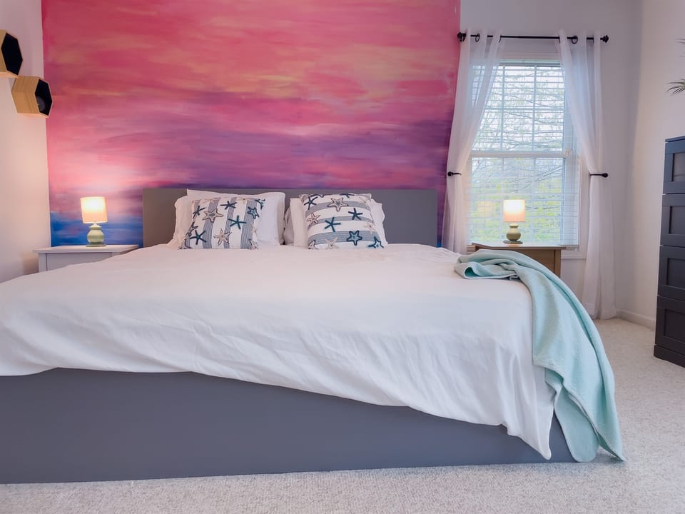 Large master bedroom with walk in closet and king bed 
