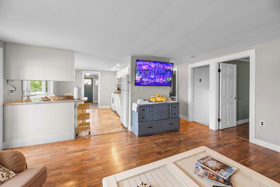 The open-concept layout makes it easy to stay connected, whether you’re preparing meals, watching the game on the 55-inch Roku Smart TV, or spending quality time together after a day on beautiful Cobbosseecontee Lake.