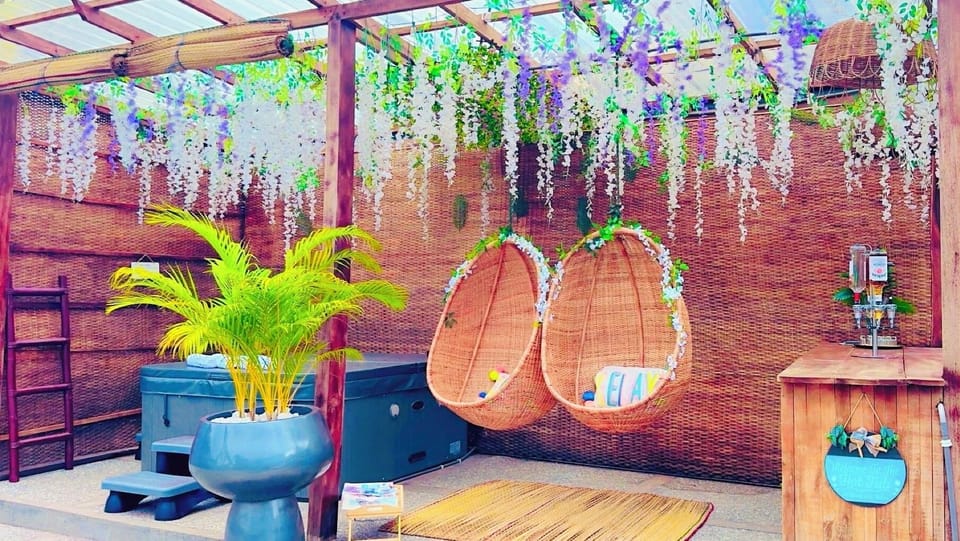 Hot Tub with hanging egg chairs with mini bar