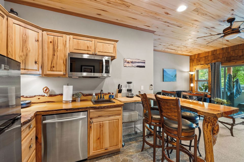 Downstairs kitchenette with a refrigerator, dishwasher, microwave, coffee maker and blender so grabbing a drink or snack is always just steps away.