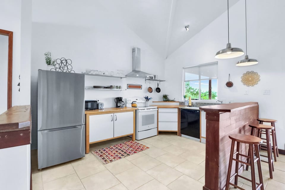 Full kitchen with refrigerator, microwave, stove, oven, and dishwasher