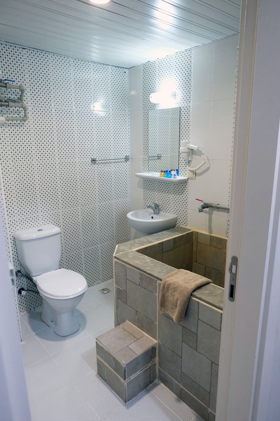 Hair dryer, slippers, towels, soap