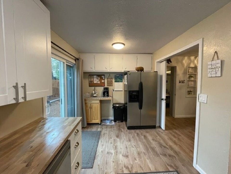 Full kitchen with utensils, cooking ware, plates, cups, bowls and more 