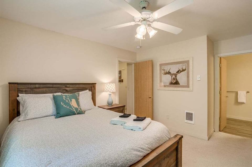 The master suite with a queen bed.