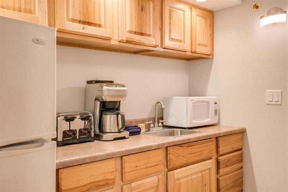 Little kitchenette is designed for making breakfast in bed.