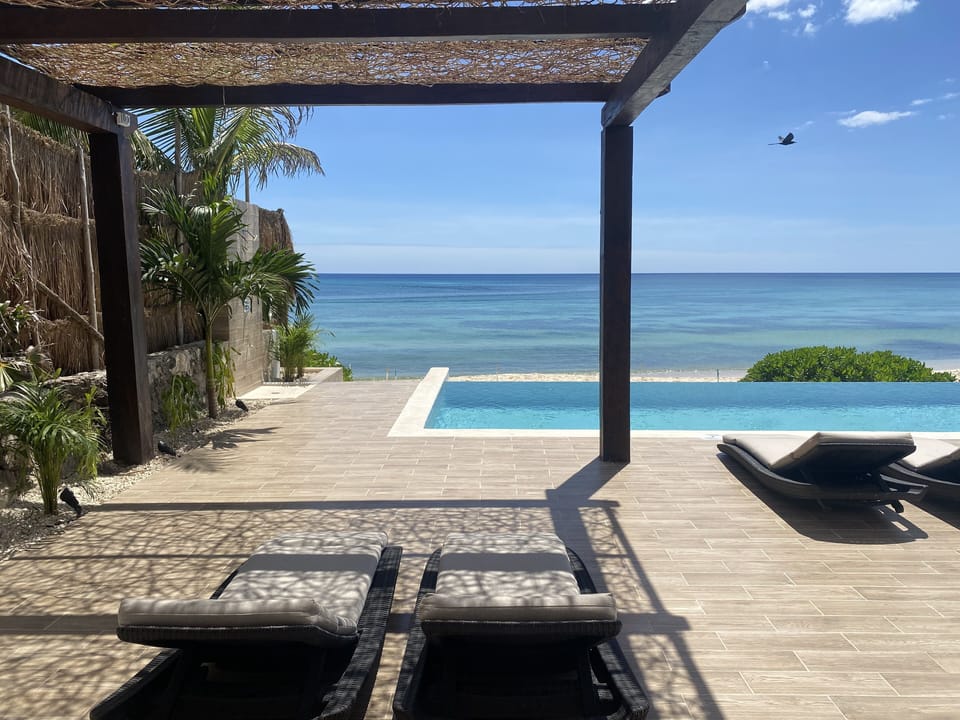 Lounge by the infinity pool or under the artistic shade provided by our pergola.