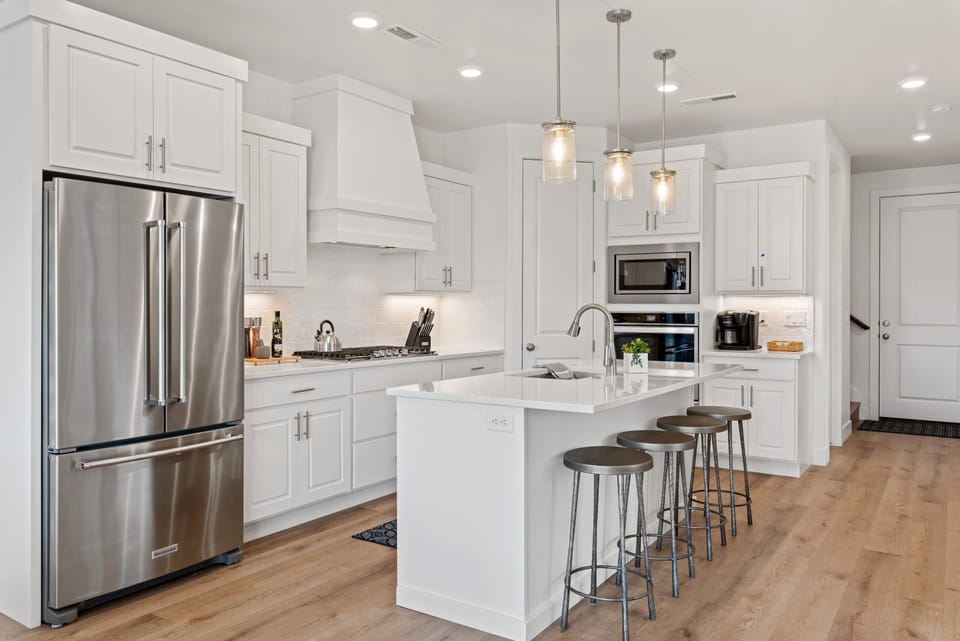 Townhome, 5 Bedrooms | Private kitchen | Fridge, oven, coffee/tea maker, toaster