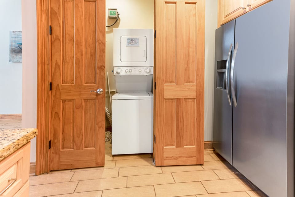 Washer and dryer next to the kitchen