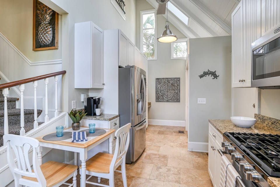 Windows in the kitchen bring in beautiful natural light.