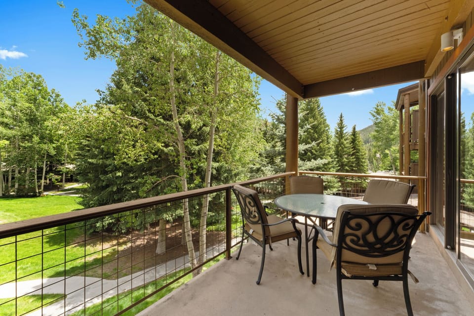 Step onto your private balcony where morning coffee tastes better surrounded by lush trees and peaceful garden views.