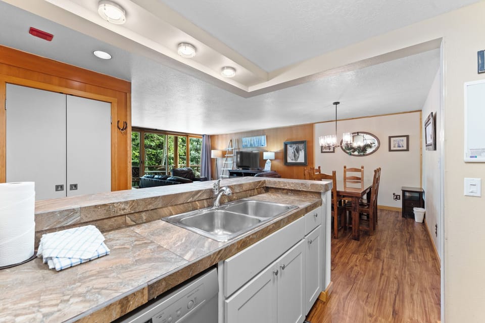 Full kitchen with breakfast bar seating 2.