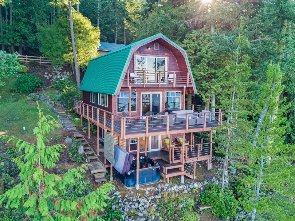 Waterview side with three decks and a hot tub