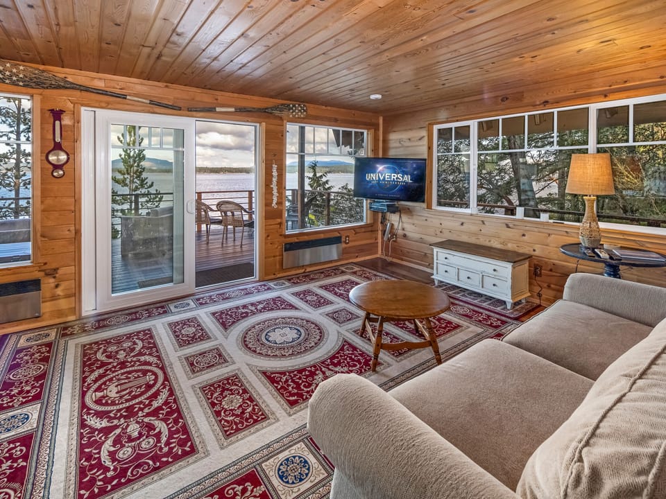 Main floor living room with stunning views of San Juan Channel and Smart TV (you will need to log in to your account to access Netflix, Hulu, etc.)