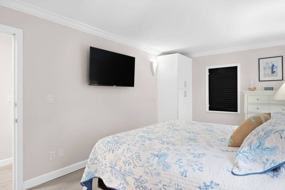 The master bedroom is outfitted with its own smart TV