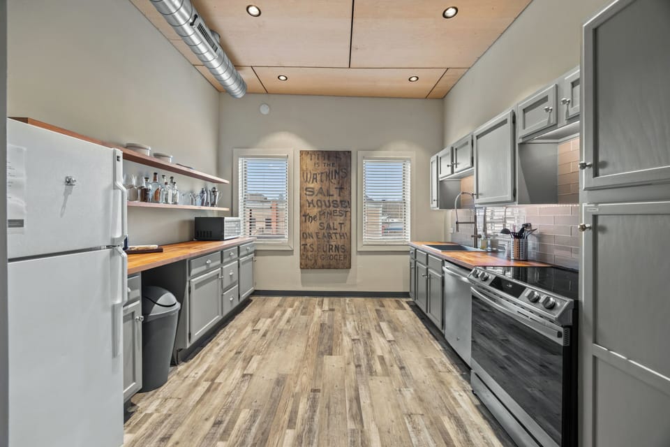 Kitchen area with windows facing over the back parking area