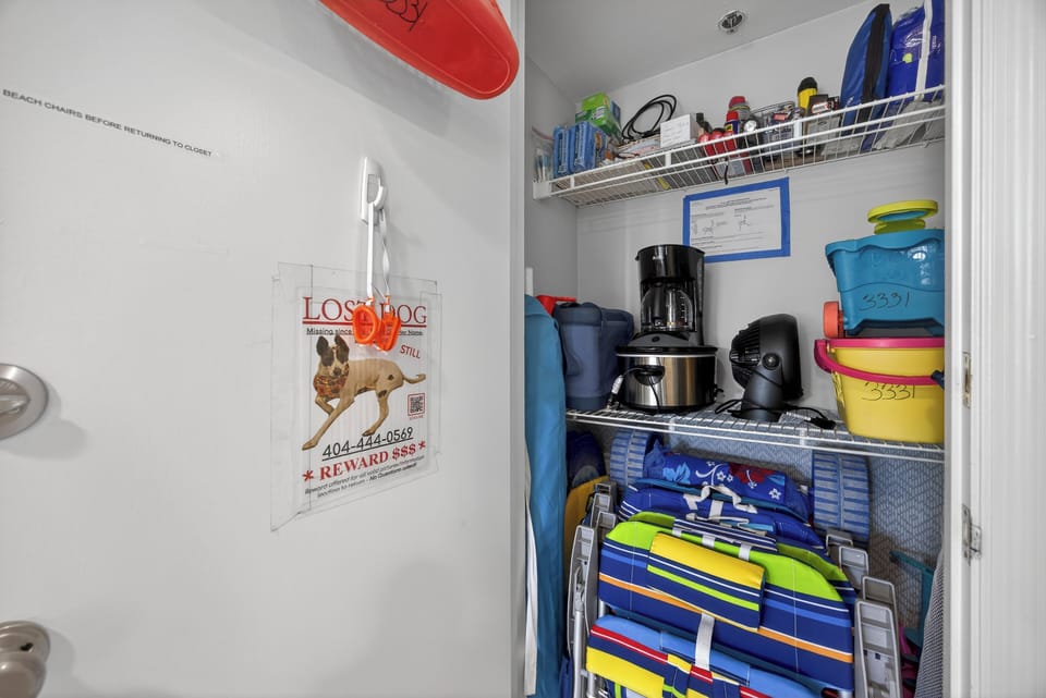 closet with beach chairs, beach buggy, toys, supplies