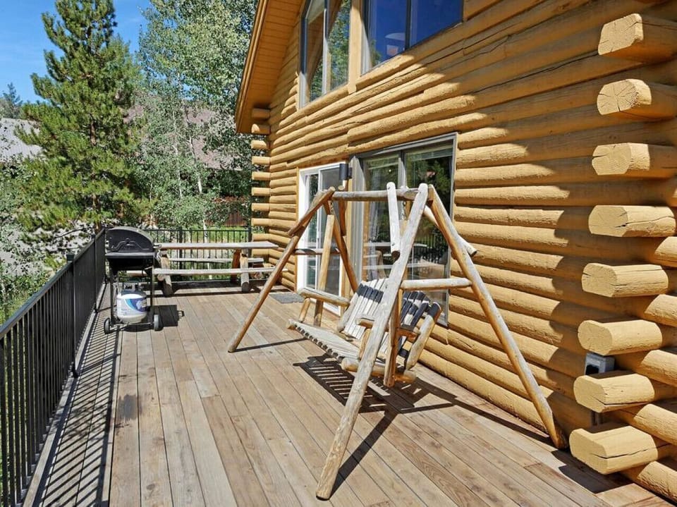 Deck with swing and grill.